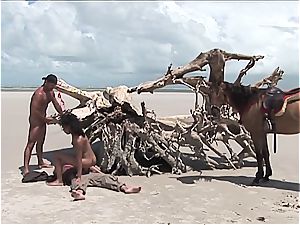 horny mexican chick gets two weenies on the beach